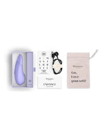 Innhold i pakken: Womanizer Enhance, ladekabel, oppbevaringspose og guider.
