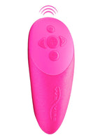 We-Vibe Chorus fjernkontroll i rosa sett forfra, med pluss-, minus- og retningsknapper samt We-Vibe-logo.