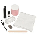 Beginner-friendly DIY body casting kit with black vibrator, molding powder, and accessories