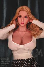 Realistic lifelike love doll with long blonde hair, white top, and polka dot skirt against dark background.