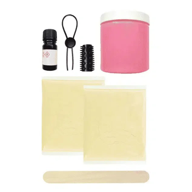 DIY molding kit with pink container, two powder bags, mixing stick, black cap bottle, and accessories