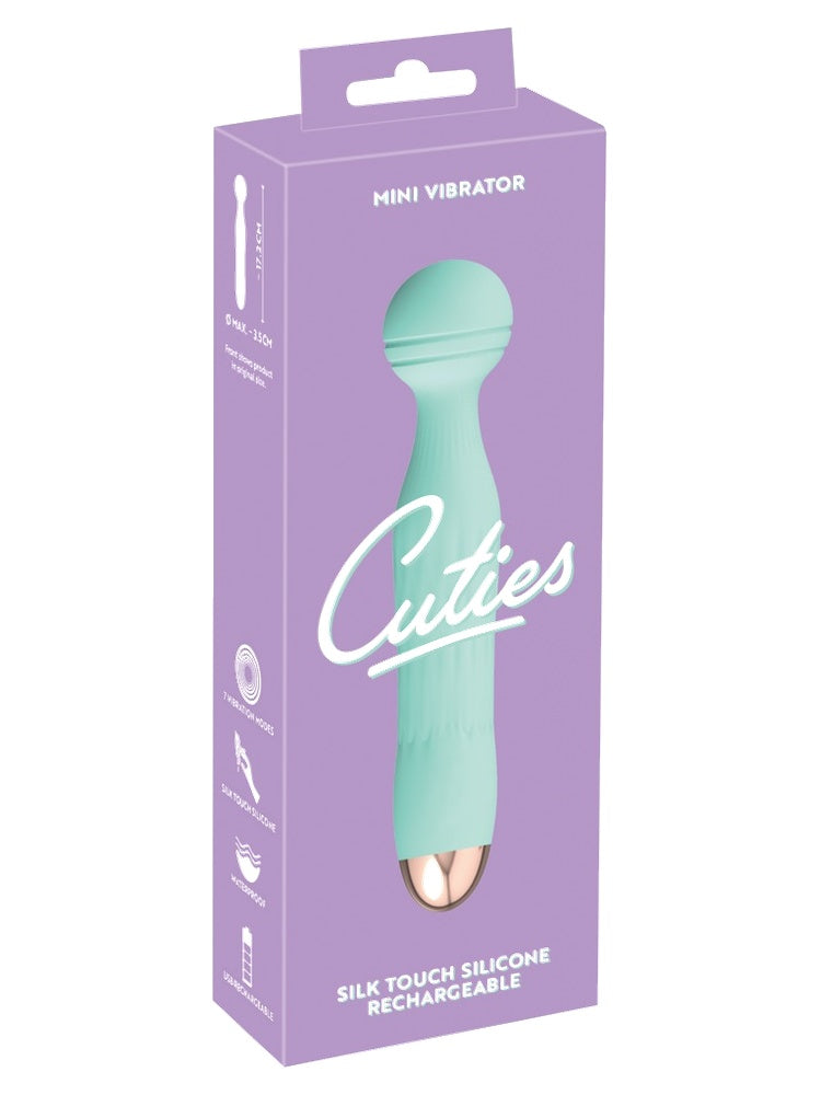 Cuties Mini Vibrator produkteske – lilla emballasje med informasjon om 7 vibrasjonsmønstre, vanntett design og USB-opplading
