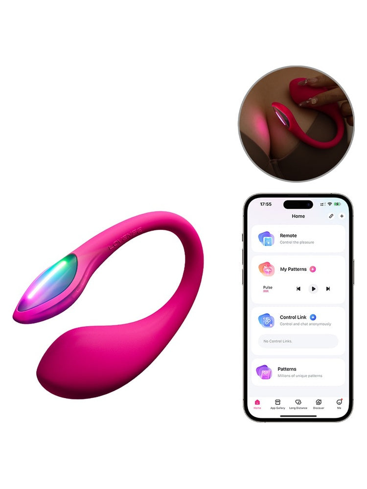 Lovense Lush Mini G-punktvibrator i rosa med fargerik LED-hale, vist med Lovense-appen og hånd som holder produktet i mørket