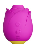 ROMP Rose klitorisstimulator i magenta, sett forfra med rosenform, av/på-knapp og logo.
