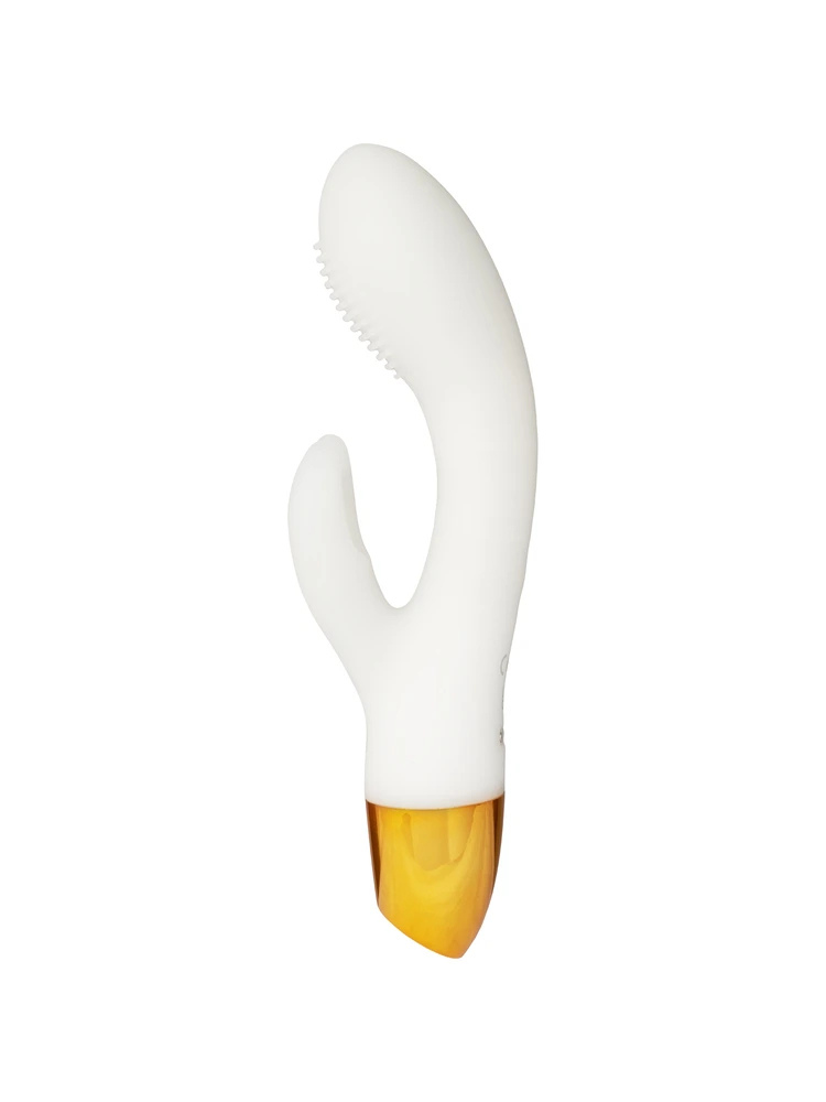 You2Toys Glow in the Dark Rabbit Vibrator sett forfra – hvit rabbitvibrator med buet skaft, klitorisstimulator og gullfarget base mot lys bakgrunn.