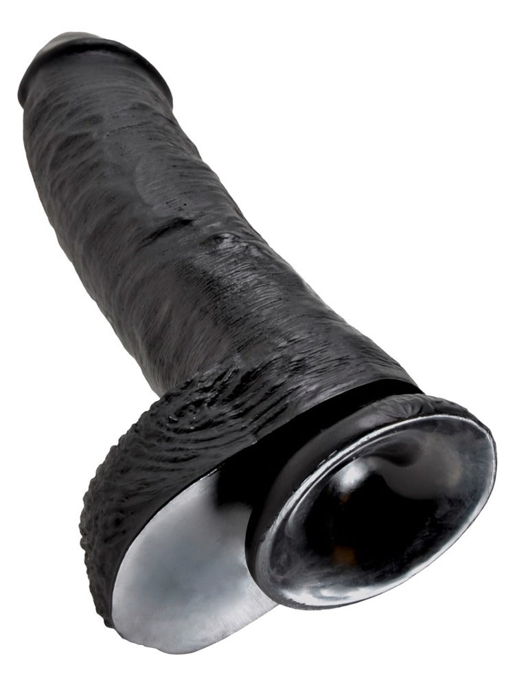 King Cock 10" med testikler – sugekoppen under på den svarte dildoen