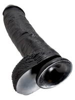 King Cock 10" med testikler – sugekoppen under på den svarte dildoen